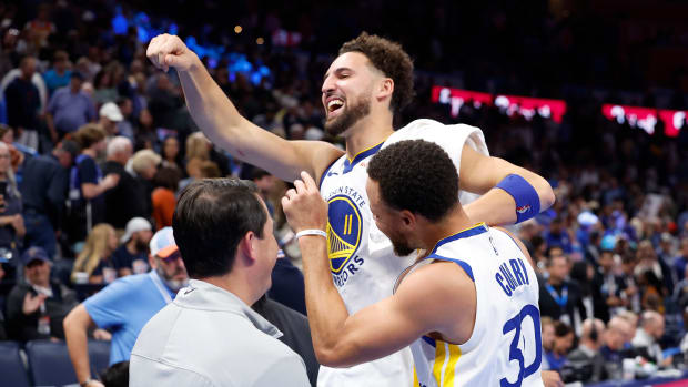 Nov 3, 2023; Oklahoma City, Oklahoma, USA; Golden State Warriors guard Klay Thompson (11) and guard Stephen Curry (30) celebrate after defeating the Oklahoma City Thunder at Paycom Center. Golden State won 141-139.